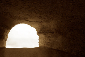 Majestic artificial rock archway, cut out. Interior of cave in Aktau, Kazakhstan. Big empty rock...