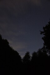 Fototapeta premium Evening sky with cassiopeia and clouds