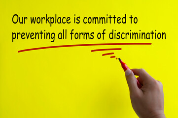 Our workplace is committed to preventing all forms of discrimination written on yellow cover. Safe...