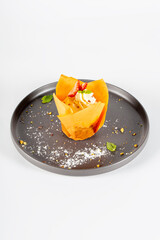 Carrot cake with whipped cream and strawberries on white background