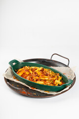  Baked potatoes with vegetables on a white background