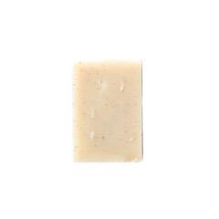 A close-up of a bar of natural soap with a light brown hue and specks of exfoliating ingredients.
