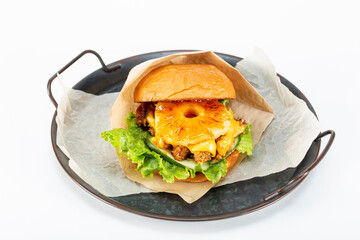 Big burger with pineapple on white background