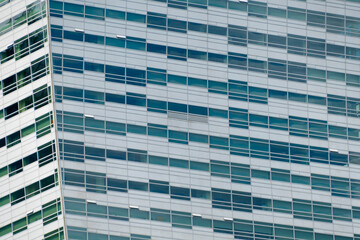 Multi-storey building in the city center. Business center, office. Modern architecture. Details of a modern building.