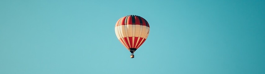 Naklejka premium Tranquil Hot Air Balloon Flight in Clear Blue Sky from Below - Minimalistic High-Resolution Shot with Simple Design