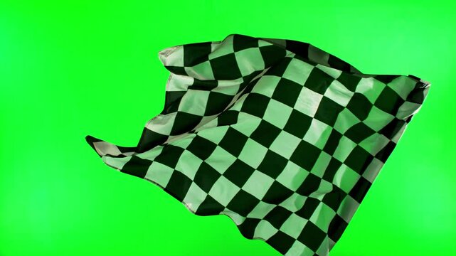 Checkered Race Flag . Slow Motion Wavy closeup fabric fluttering Racing Flag on green screen background . Formula One flag car motor sport .