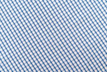 Checkered blue fabric. Textile. Checkered fabric background with blue and white cells