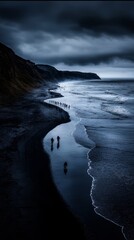 Aerial View of People Walking on a Sandy Beach With Waves Under a Cloudy Sky