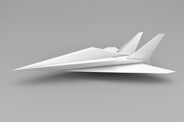 A white paper airplane, meticulously folded, takes flight against a minimalist gray backdrop