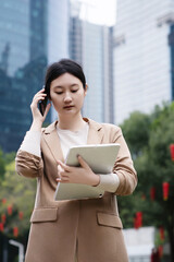 Professional Woman in Urban Setting Engaged in Business Communication