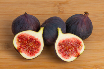 Fresh figs on wooden background