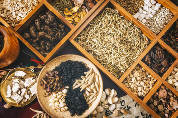 Colorful Display of Dried Herbs and Spices in Wooden Bowls