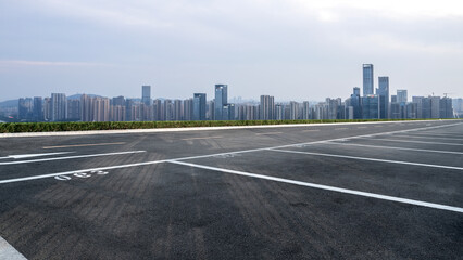 Expansive Urban Parking Lot Overlooking a Modern City Skyline