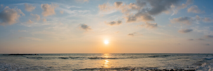 Dramatic panorama sky with cloud on sunrise and sunset time at a beach. Panoramic image.
