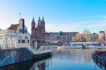 Obraz premium Church of St Nicholas over canal, Amsterdam, Holland