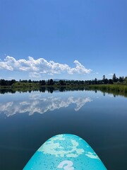 Paddle boarding on a clear river