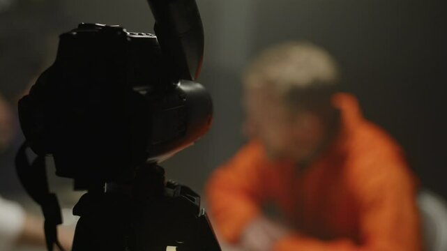 Video camera recording a testimony from inmate