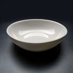 White ceramic bowl with a unique, rounded design. Perfect for serving dips, sauces, or small snacks.