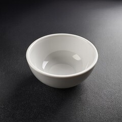 White ceramic bowl with a unique, rounded design. Perfect for serving dips, sauces, or small snacks.