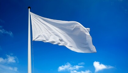 White flag waving in the wind on a pole.