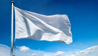White flag waving in the wind on a pole.