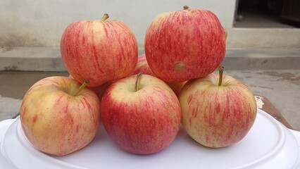 red apples on a wooden table