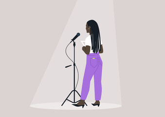 A person faces a microphone on stage, bathed in soft spotlight, creating an atmosphere of anticipation and excitement prior to their performance
