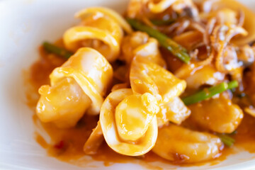 Stir fried squid with salted egg york. Delicious Thai dish.