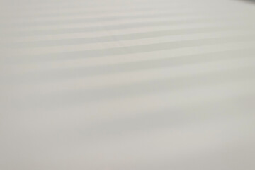 Soft, textured surface with gentle waves, creating a serene and calming atmosphere for various design projects.