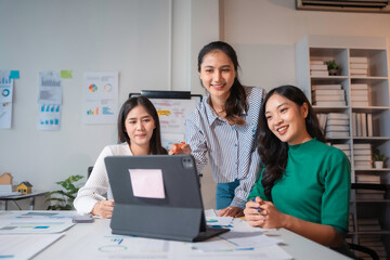 Group of asian businesswomen having meeting in modern office