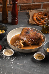 Traditional german eisbein pork knuckle with sauce