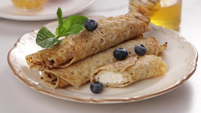 hand put berries o crepes stuffed with cheese