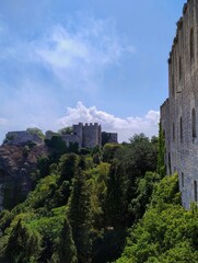 Ancient fortress. Historical norman castle on a hill surrounded by nature. Cloudy sky. Beautiful summer day in Erice with cablecar. Sicilian village. Italian life. 