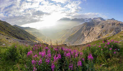 Impressive sunrise at italian Dolomiites. Wonderful Picturesque landscape with colorful dramatic sky over the mountain valley.