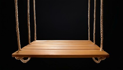 Wooden swing isolated on black background.