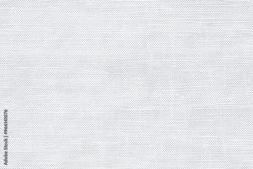 Poster textured cotton canvas fabric surface in light gray color, showcasing a subtle weave pattern.