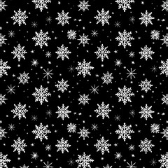 Black and white seamless pattern featuring various intricate snowflakes and stars.