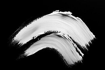 bright white brush stroke of paint on black background
