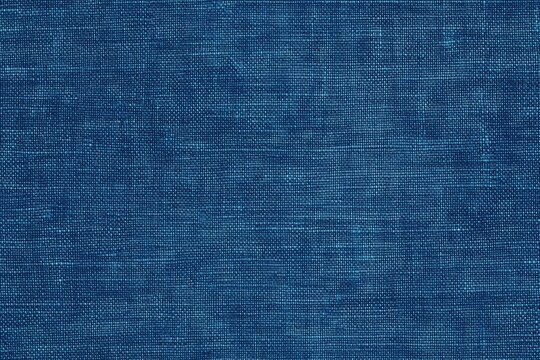 Textured blue cotton chambray fabric, showcasing a rich, deep hue with subtle variations in tone and weave.