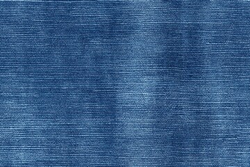 Textured blue cotton chambray denim fabric, showcasing its woven pattern and color variations.