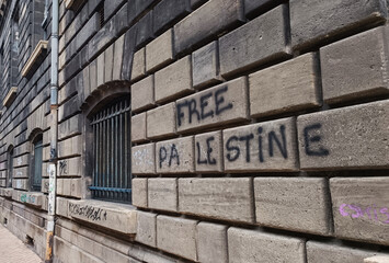 Naklejka premium Political anti-war graffiti on urban wall