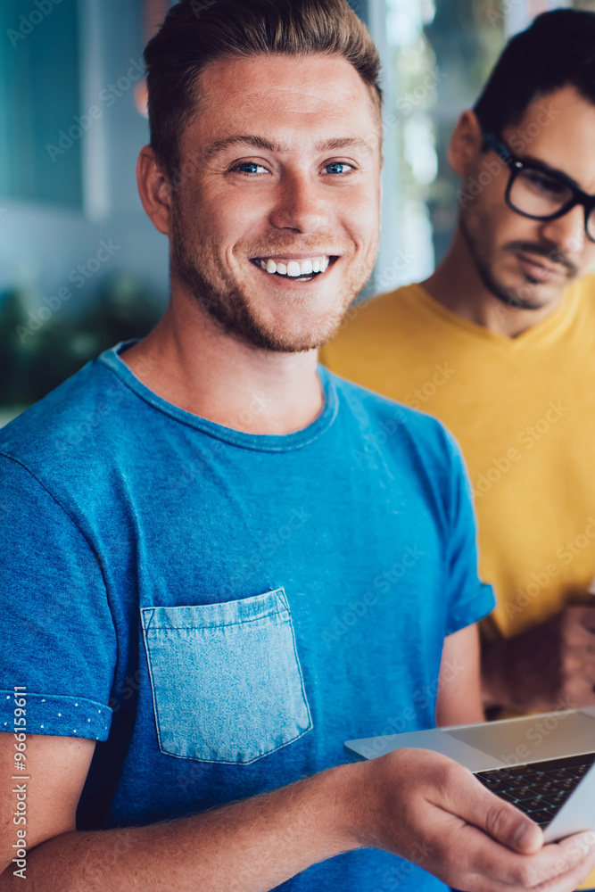 Aufkleber half length portrait of cheerful caucasian male it professional holding laptop computer in hand and 