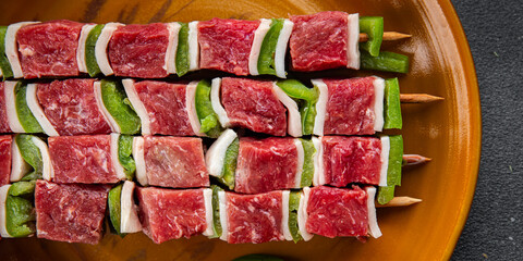 raw kebab meat and vegetables pork, lard, pepper, vegetable dish fresh delicious gourmet food background on the table rustic food top view copy space