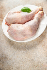 chicken meat legs raw poultry flesh on the bone gourmet fresh meal food snack on the table copy...