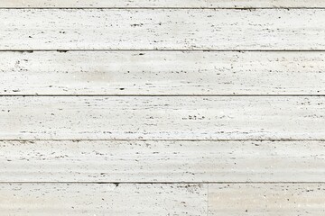 White wooden planks with a weathered texture, showcasing natural grain patterns and subtle imperfections.