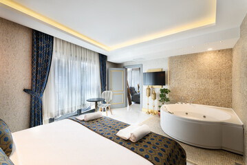 Luxury Hotel Suite Bedroom with Jacuzzi..