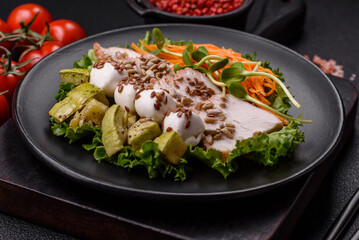 Delicious diet salad with turkey or chicken slices, lettuce, carrots, mozzarella