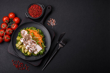 Delicious diet salad with turkey or chicken slices, lettuce, carrots, mozzarella