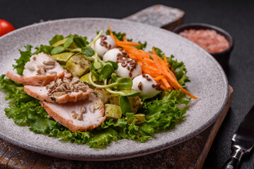 Delicious diet salad with turkey or chicken slices, lettuce, carrots, mozzarella