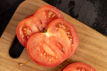 fresh soft tomatoes in drops of water